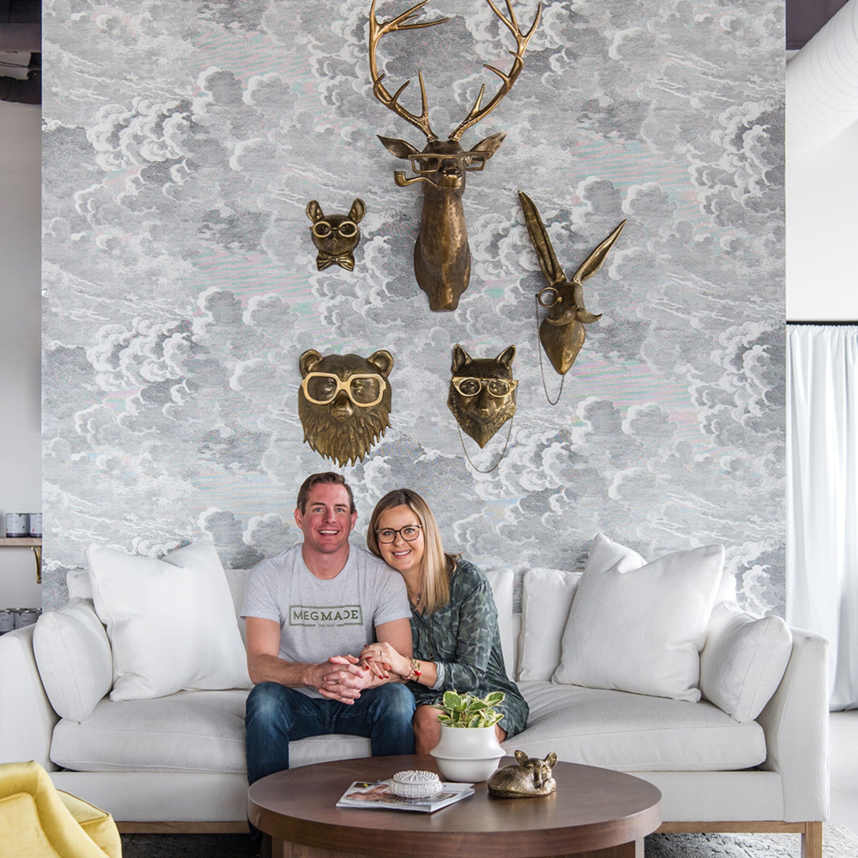 Meg and Joe Piercy sitting on the couch of their newest showroom in Munster, IN