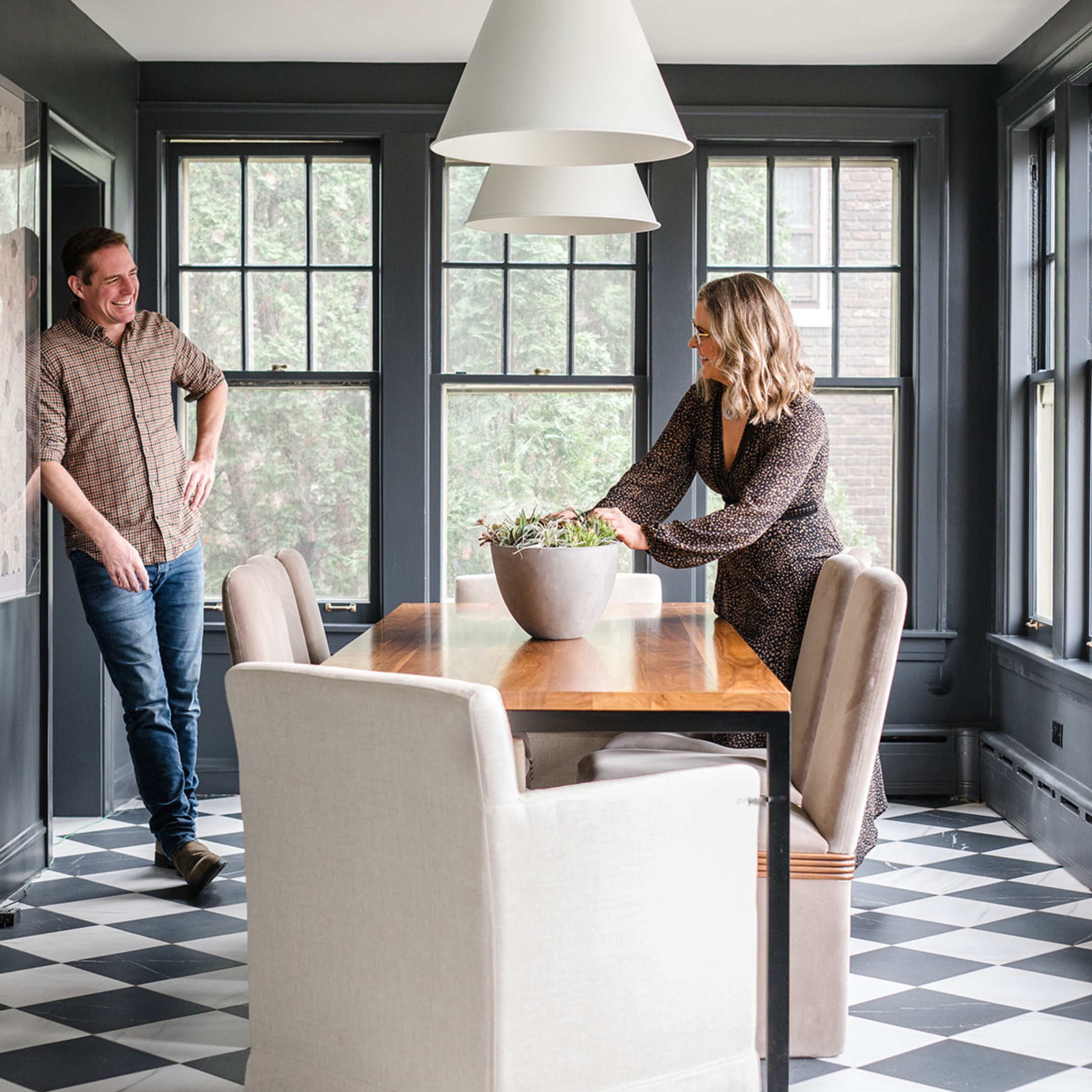 Meg and Joe Piercy looking at each other in a room they designed