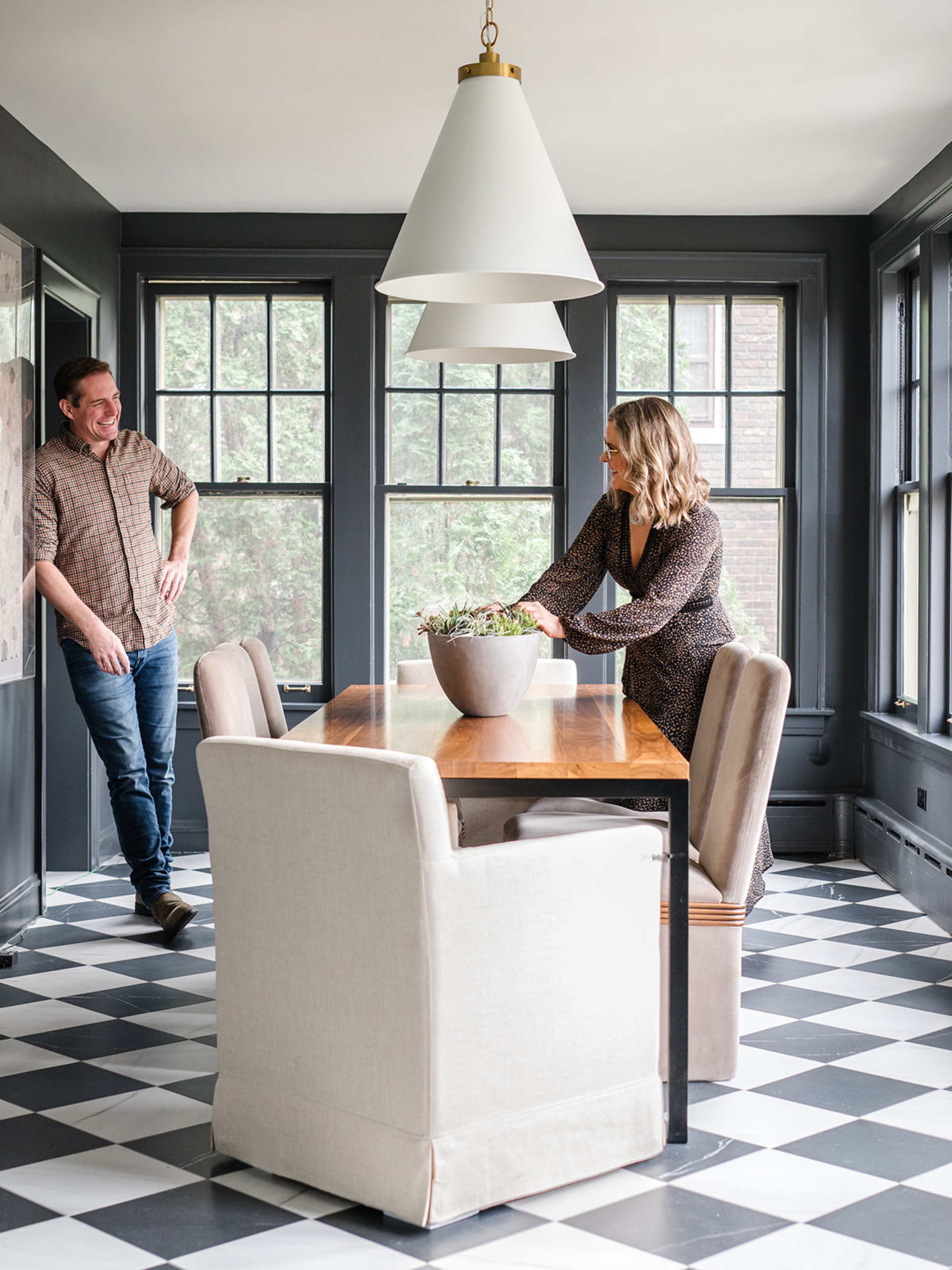 Meg and Joe Piercy looking at each other in a room they designed
