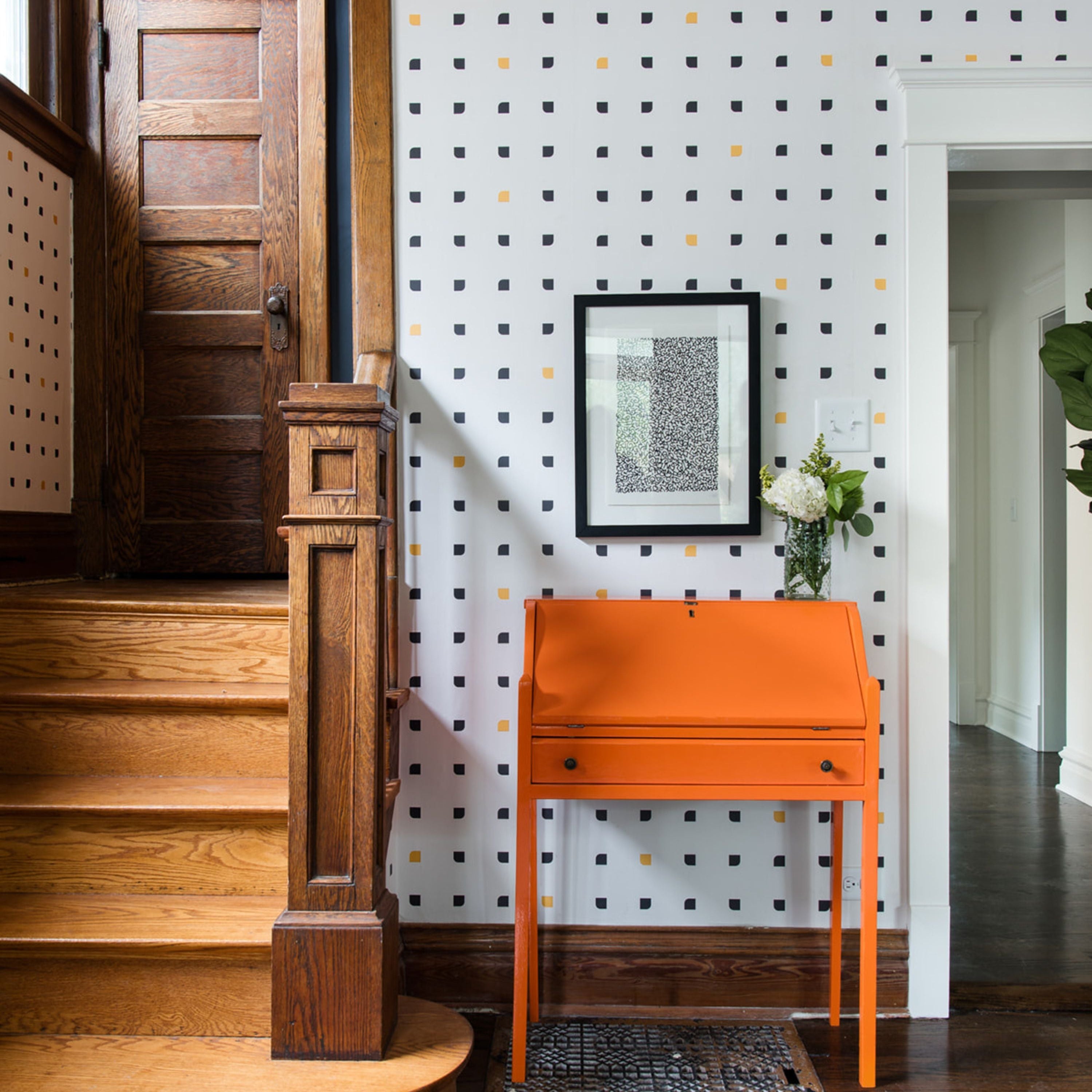 A DIYed piece of furntiure in an entryway of a home